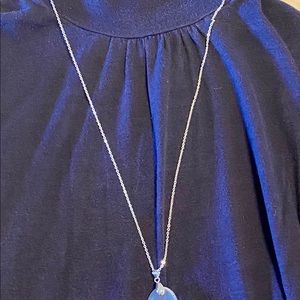 Beautiful angel aura pendant on sparkling chain.